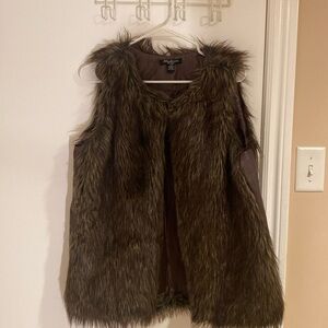 Faux fur vest with leather trim on the side